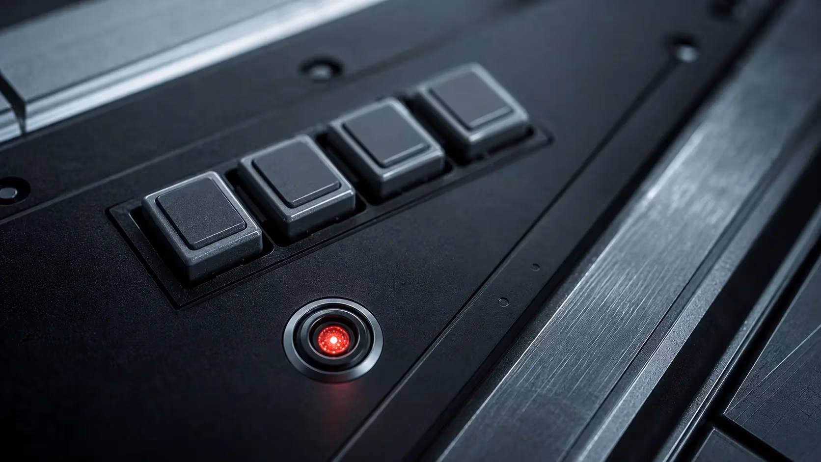 "Console debug metallica con quattro pulsanti e uno con LED rosso: lo strumento debug attivo"